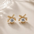 JM Collection Brinco Laço com Zircônia Central Dourado e Prata Acabamento Premium Zircônia Brilhante Elegância e Versatilidade
